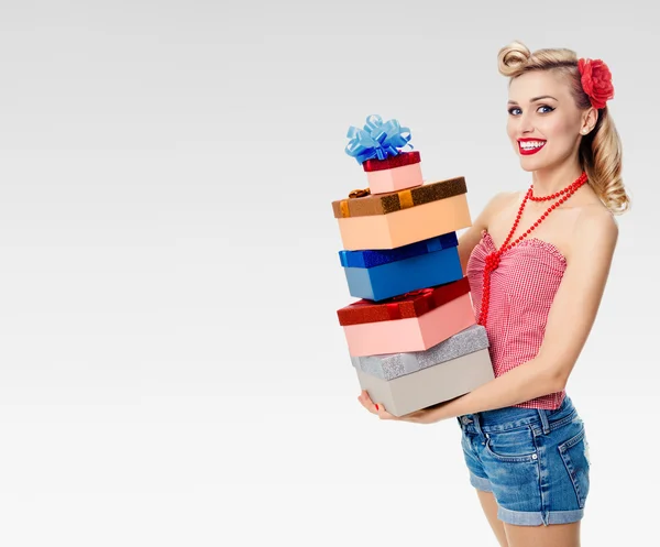 Woman in pin-up style with gifts — Stock Photo, Image