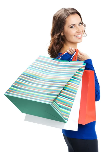 Young happy woman with shopping bags, isolated Royalty Free Stock Images