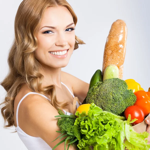 Mujer con comida vegetariana —  Fotos de Stock