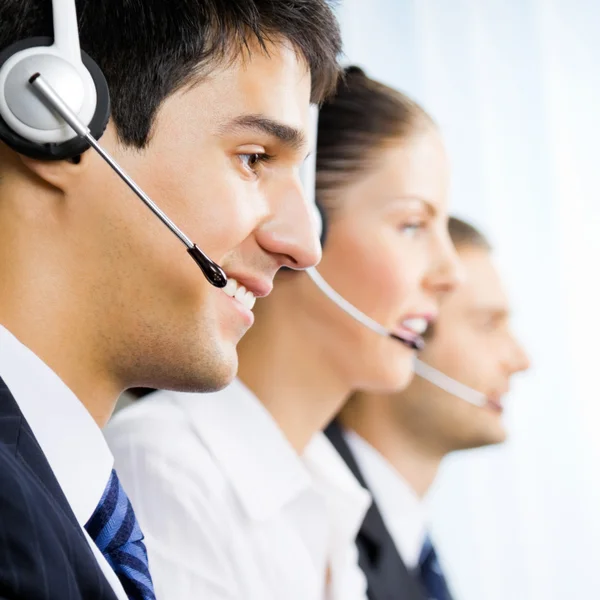 Three customer support phone operators — Stock Photo, Image