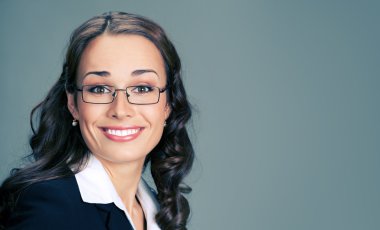 Businesswoman in glasses, on gray clipart