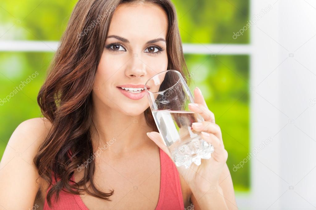 Young woman drinking water, outdoor