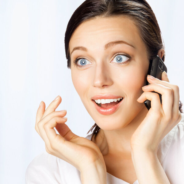 Business woman with cell phone, at office