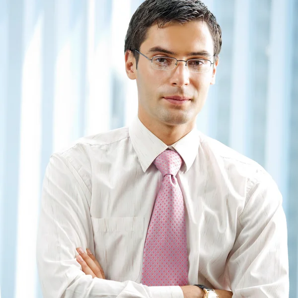 Portrait of young successful businessman at office — Stock Photo, Image