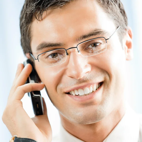 Businessman with cellphone at office Stock Photo