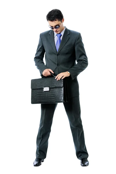 Businessman or hacker in sun glasses with briefcase, isolated — Stock Photo, Image