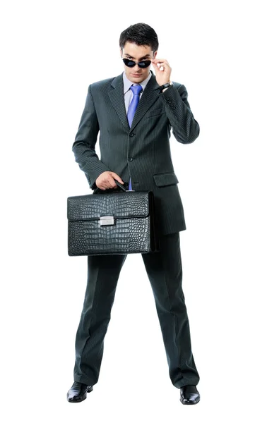 Businessman or hacker in sun glasses with briefcase, isolated — Stock Photo, Image