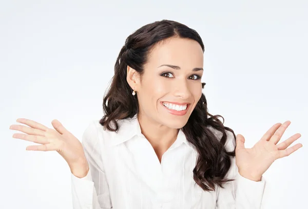 Happy gesturing smiling business woman, on grey — Stock Photo, Image