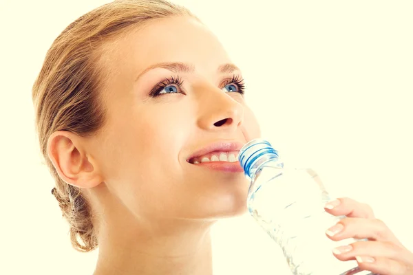 Portrait of beautiful young blond woman drinking water — Stock Photo, Image