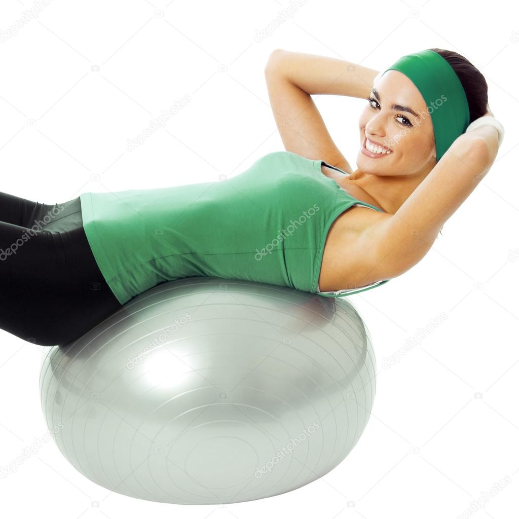 Woman with fitness ball, on white