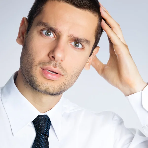 Shocked young businessman — Stock Photo, Image