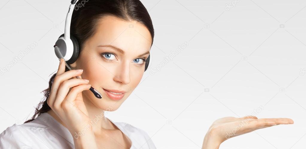 Young support phone operator showing something