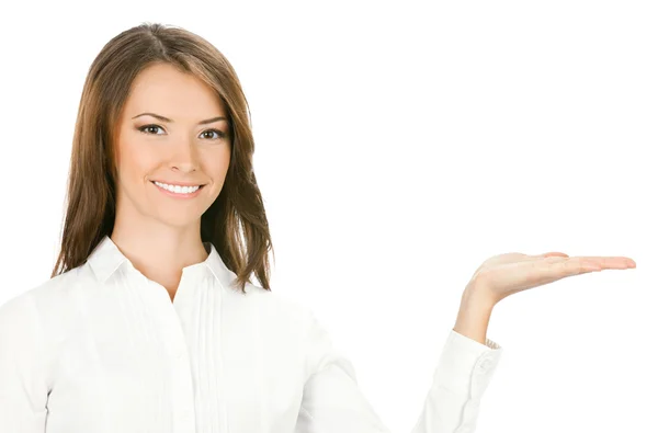 Деловая женщина показывает что-то или держит, на белом Лицензионные Стоковые Изображения