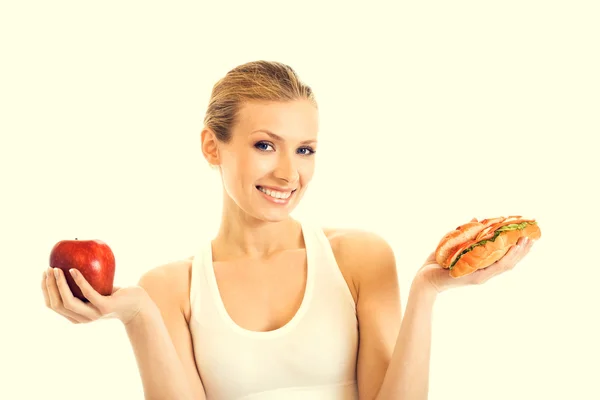 Portret van vrouw met sandwich en apple — Stockfoto