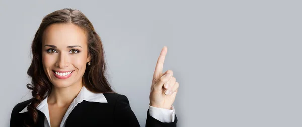 Young businesswoman showing copyspace — Stock Photo, Image