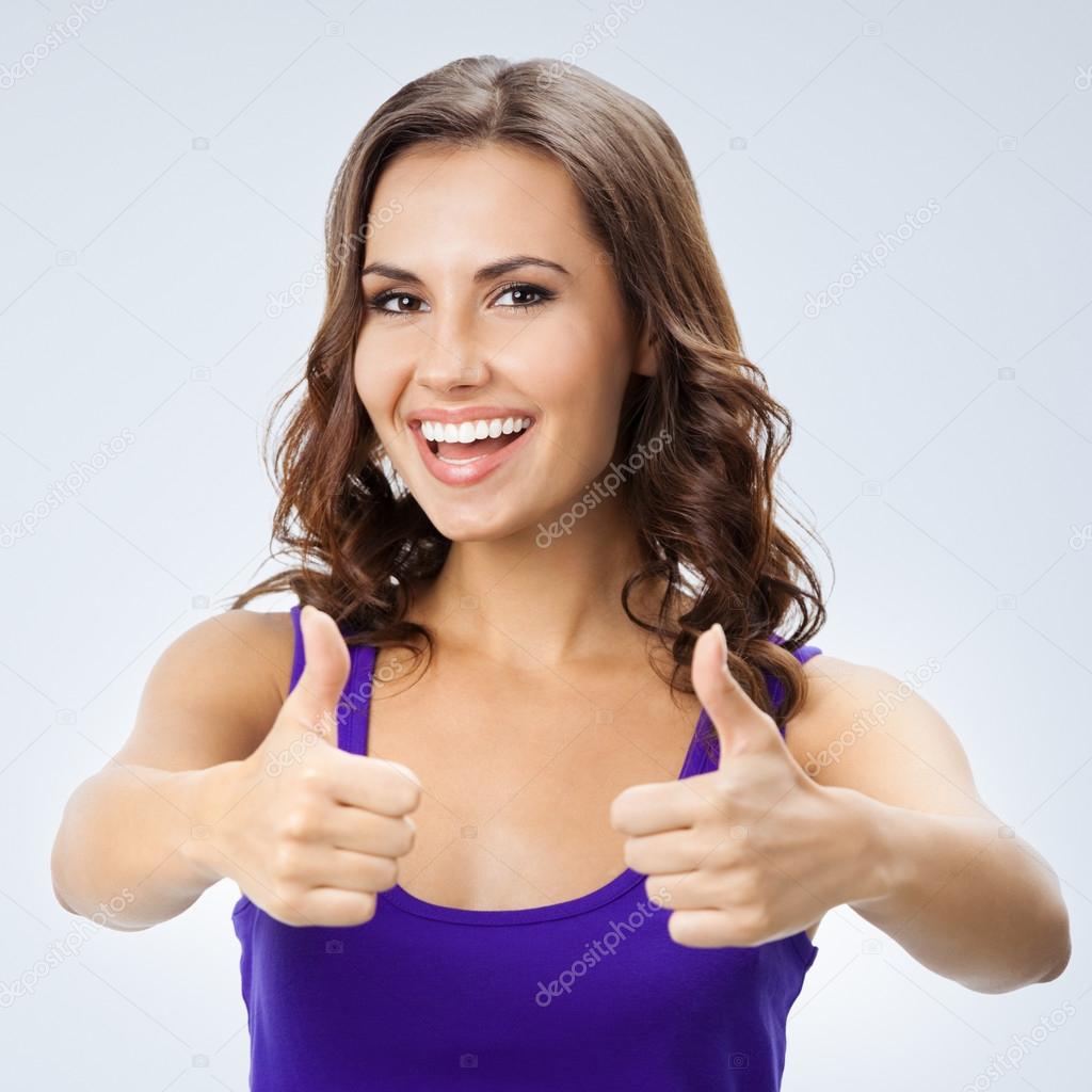 Woman showing thumbs up gesture