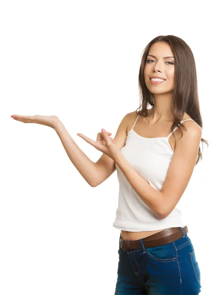 Young woman showing copyspace or something, on white — Stock Photo, Image