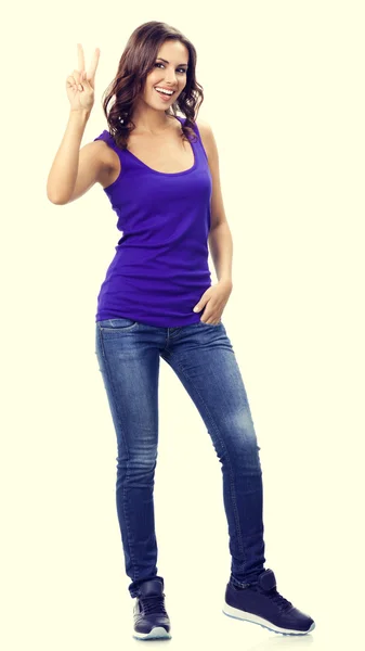 Young woman showing two fingers or victory gesture — Stock Photo, Image