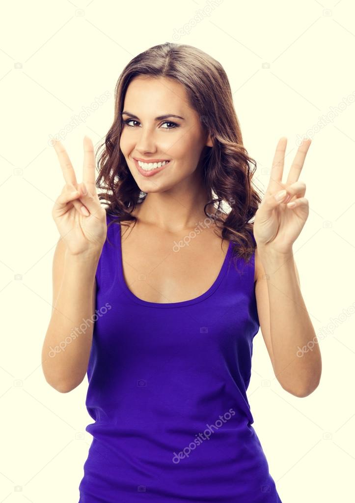 Woman showing two fingers or victory gesture