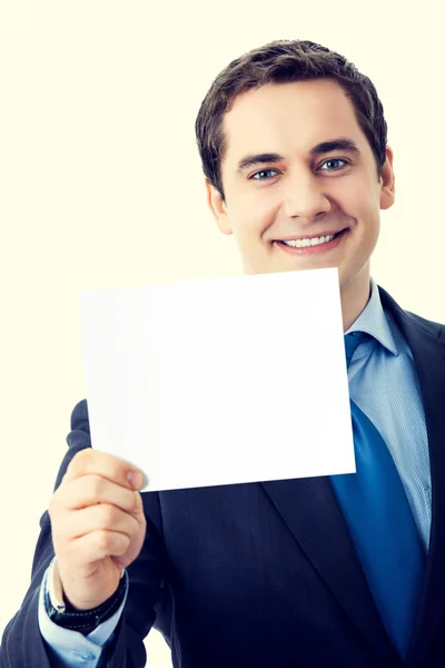 Felice uomo d'affari sorridente mostrando cartello bianco — Foto Stock