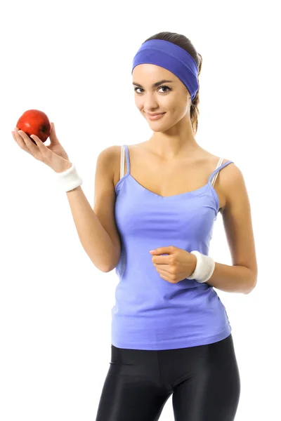 Portrait of woman in violet sportswear with apple, over white — Stock Photo, Image