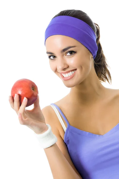 Mujer en ropa deportiva violeta con manzana roja, aislada —  Fotos de Stock