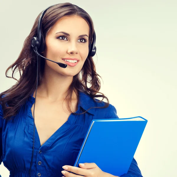 Suporte a operadora de telefone em fone de ouvido com pasta azul — Fotografia de Stock