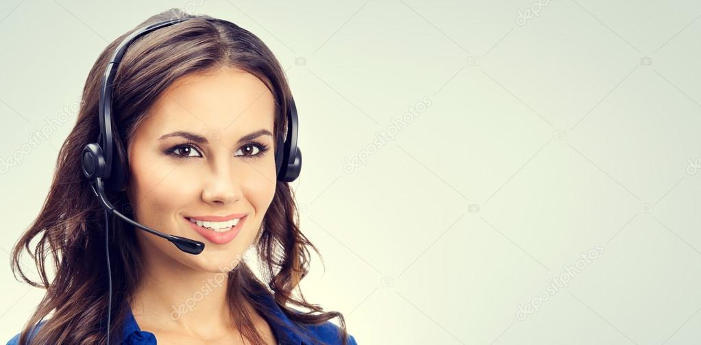Portrait cheerful young support phone operator, with copyspace 