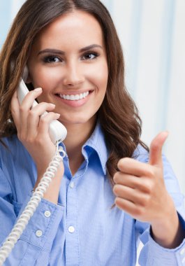 customer support phone worker showing thumb up hand sign geture