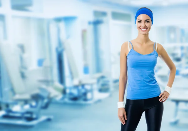 Happy smiling woman in sportswear, with copyspace — Stock Photo, Image