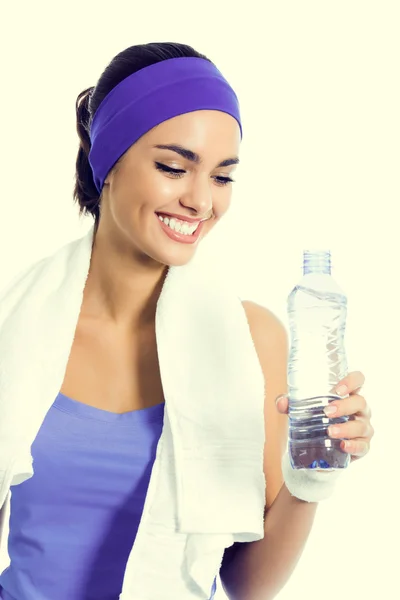 Woman in violet sportswear drinking water — Stock Photo, Image