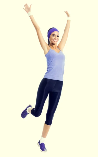 Feliz sonriente mujer saltando o haciendo ejercicio aeróbico fitness —  Fotos de Stock