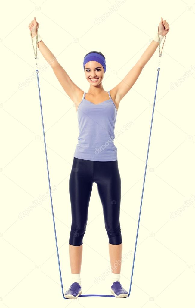 woman in violet sportswear, doing fitness exercise with growth