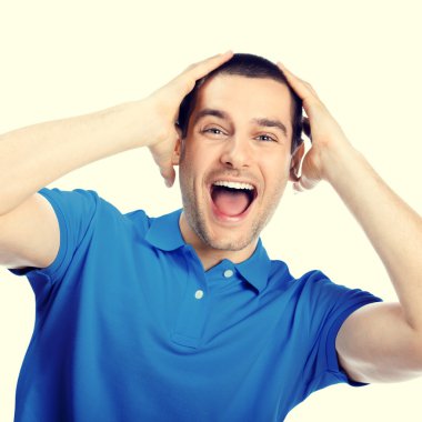 Portrait of shocked young man, looking at camera