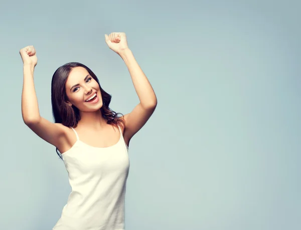 Happy gesturing young brunette woman, with copyspace — Stock Photo, Image