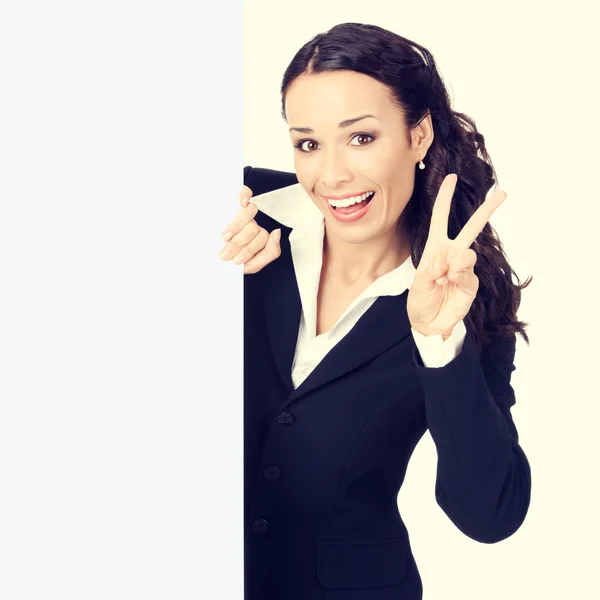 Businesswoman with blank signboard, showing two fingers — Zdjęcie stockowe