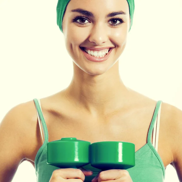 Mujer joven haciendo ejercicio con pesas — Foto de Stock