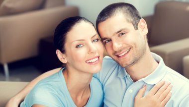 happy smiling lovely couple at home