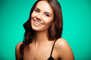beautiful cheerful smiling woman, over bright green