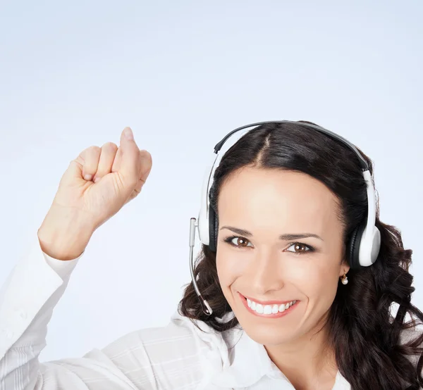 Happy gesturing female support phone operator — Stockfoto