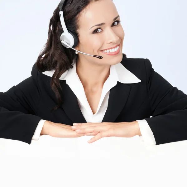 Young smiling female support phone operator with signboard — ストック写真