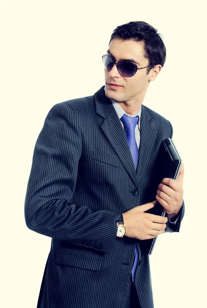 Businessman or hacker in sun glasses with laptop — Stock Photo, Image