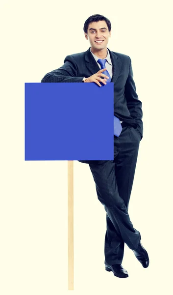 Young businessman showing blank signboard — Stock Photo, Image