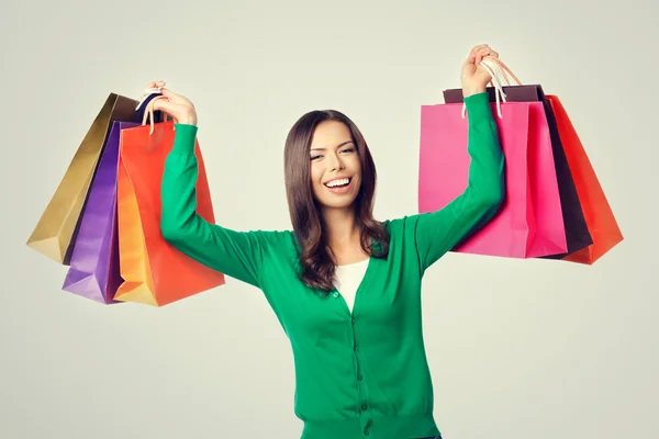 Joven mujer encantadora con bolsas de compras —  Fotos de Stock