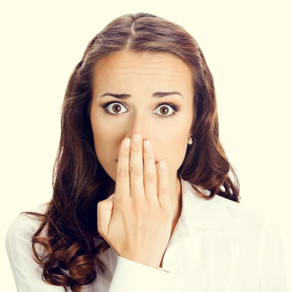 Business woman covering mouth Stock Photo