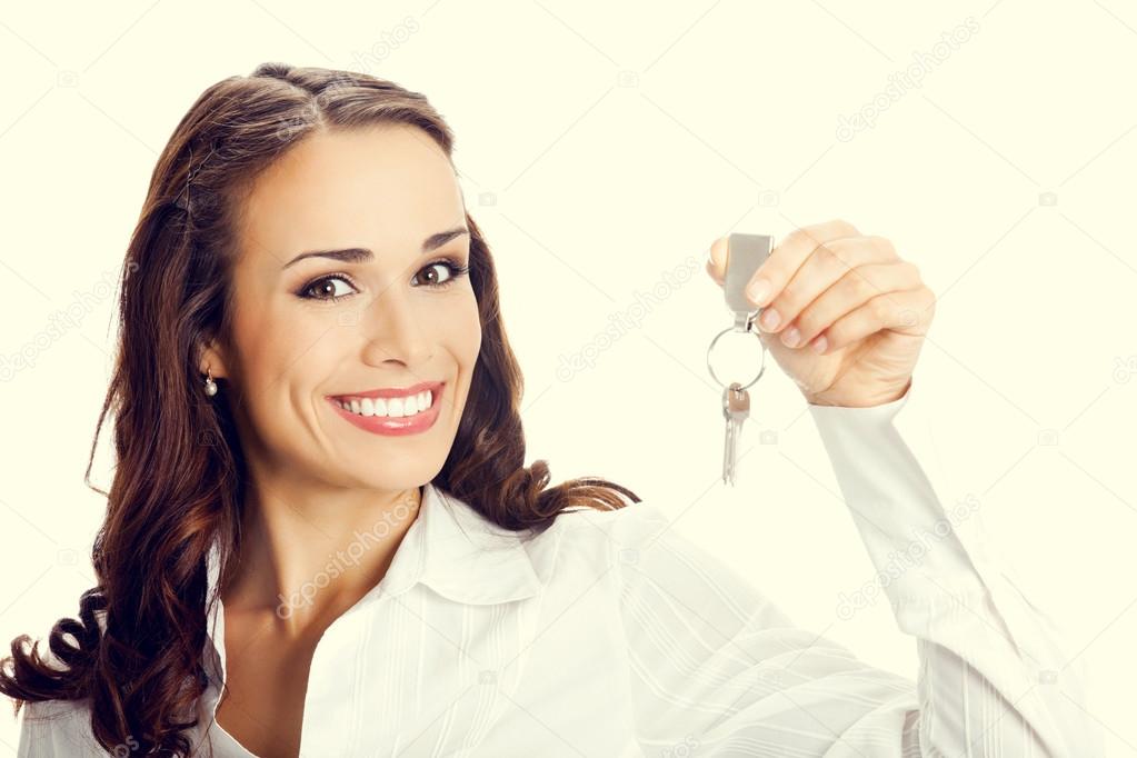 Businesswoman or real estate agent showing keys