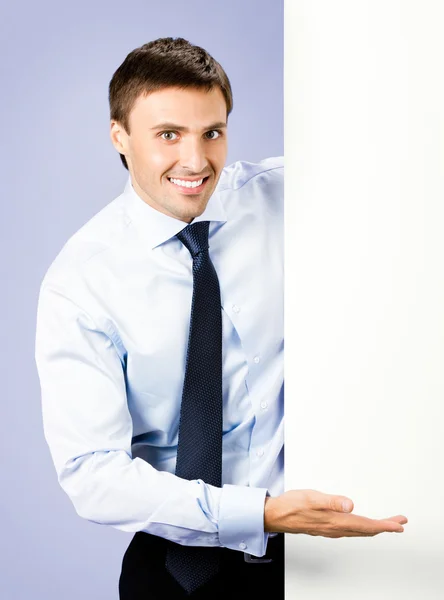 Business man showing blank signboard, over violet — Φωτογραφία Αρχείου