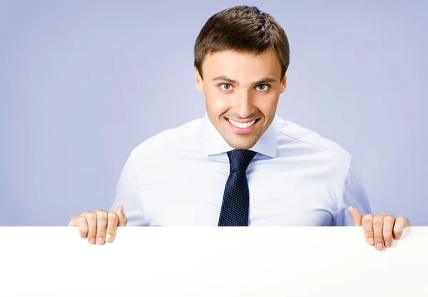 Business man showing blank signboard, over violet — Stock Photo, Image