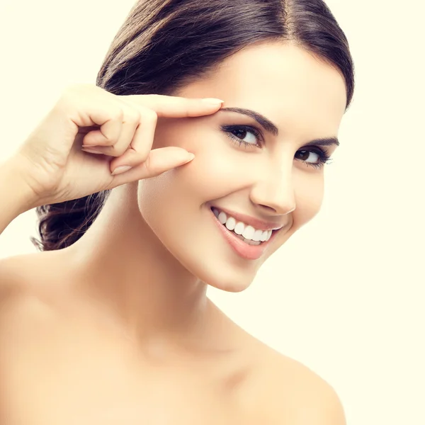 Woman touching skin or applying cream — Stock Photo, Image