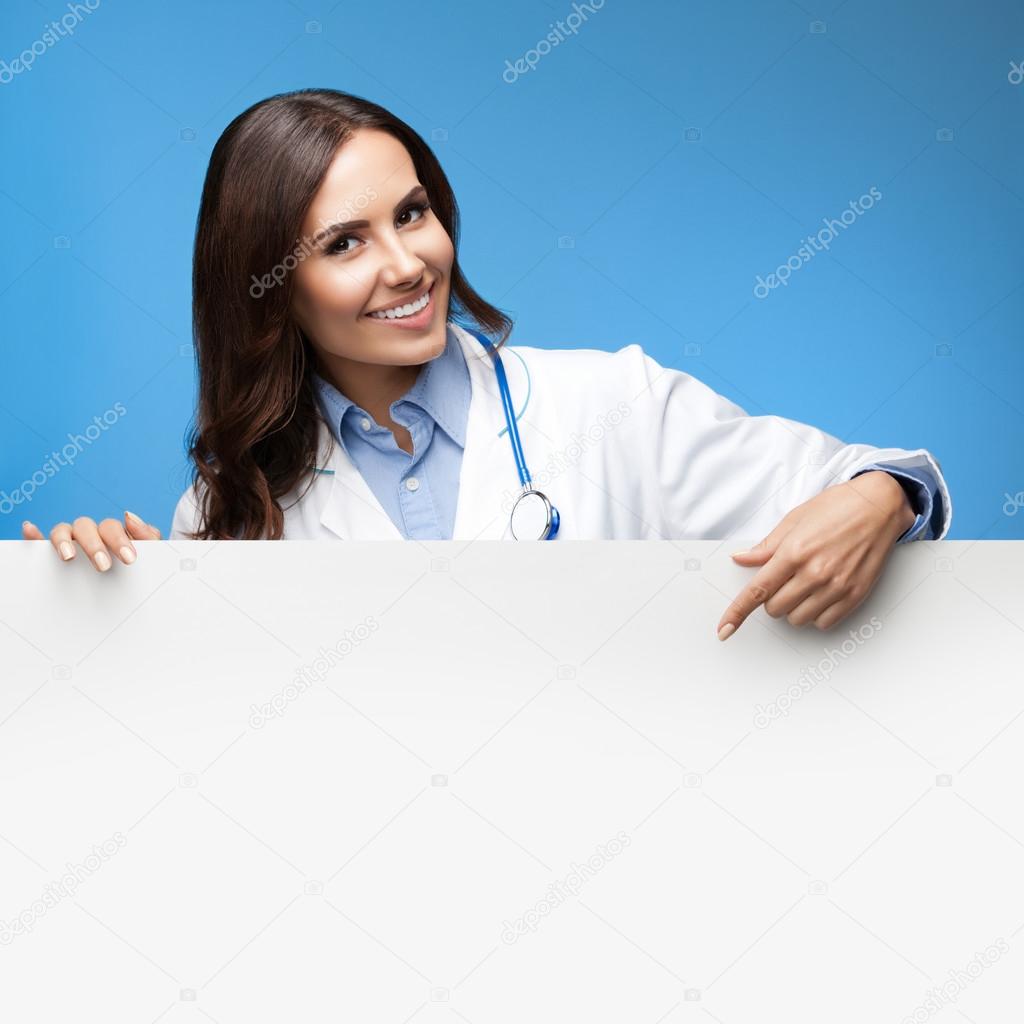 female doctor showing blank signboard, over blue